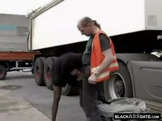 Black prostitute riding on perfected truck driver outside